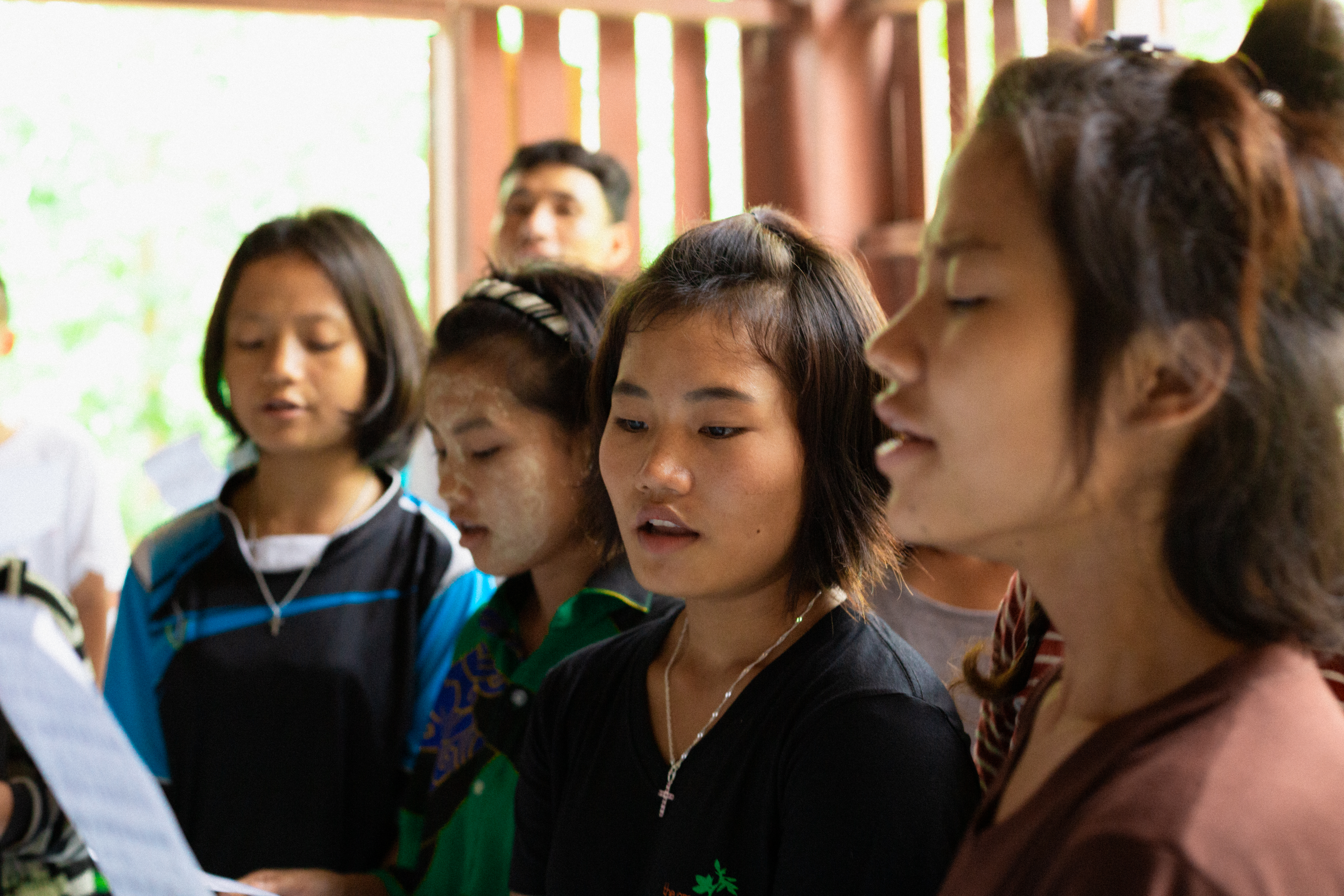 La June Paw singing in choir