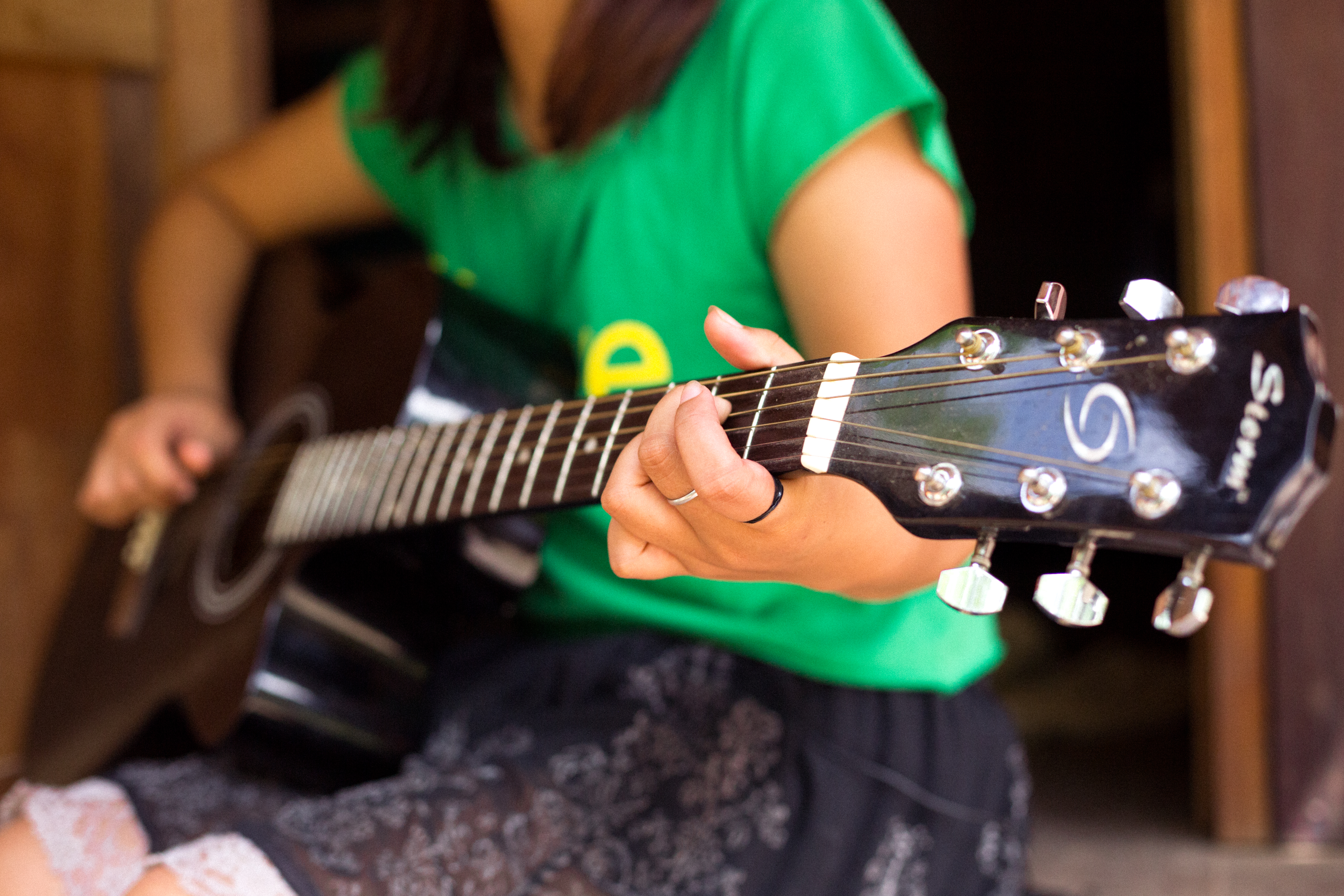 La June Paw playing guitar